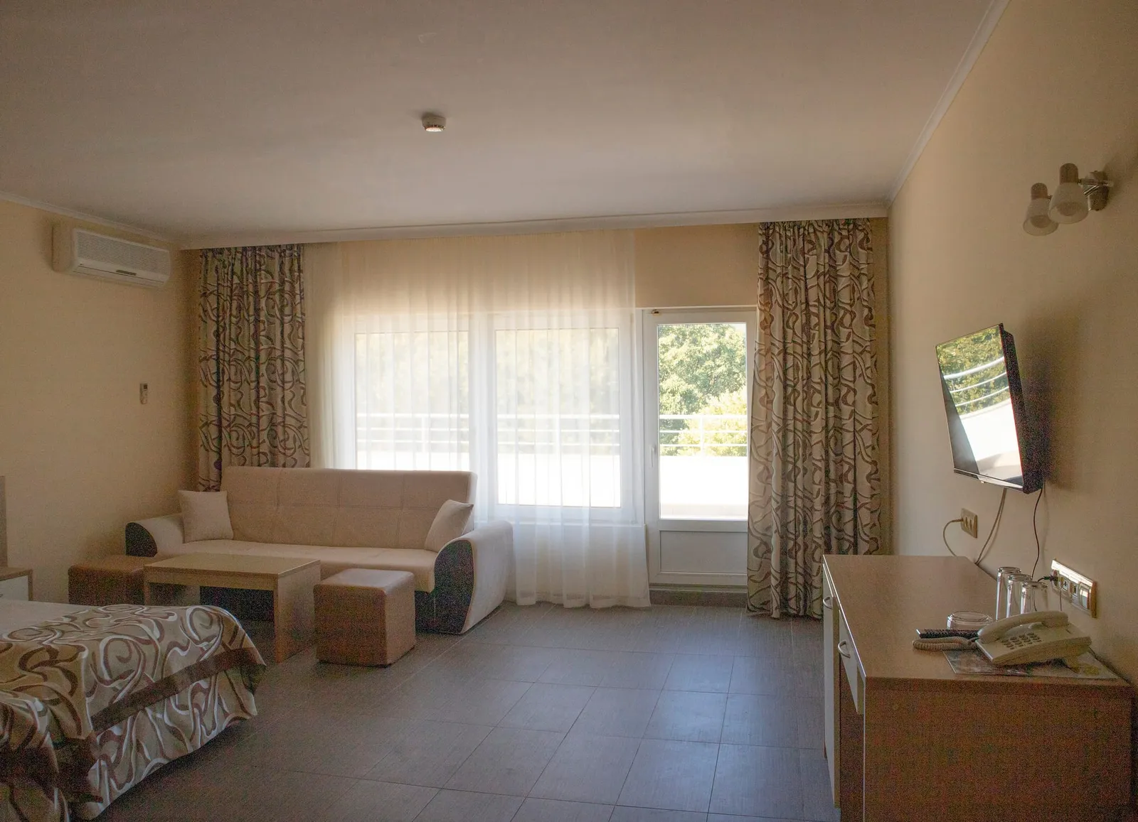 Family Room: double bed, sofa and TV