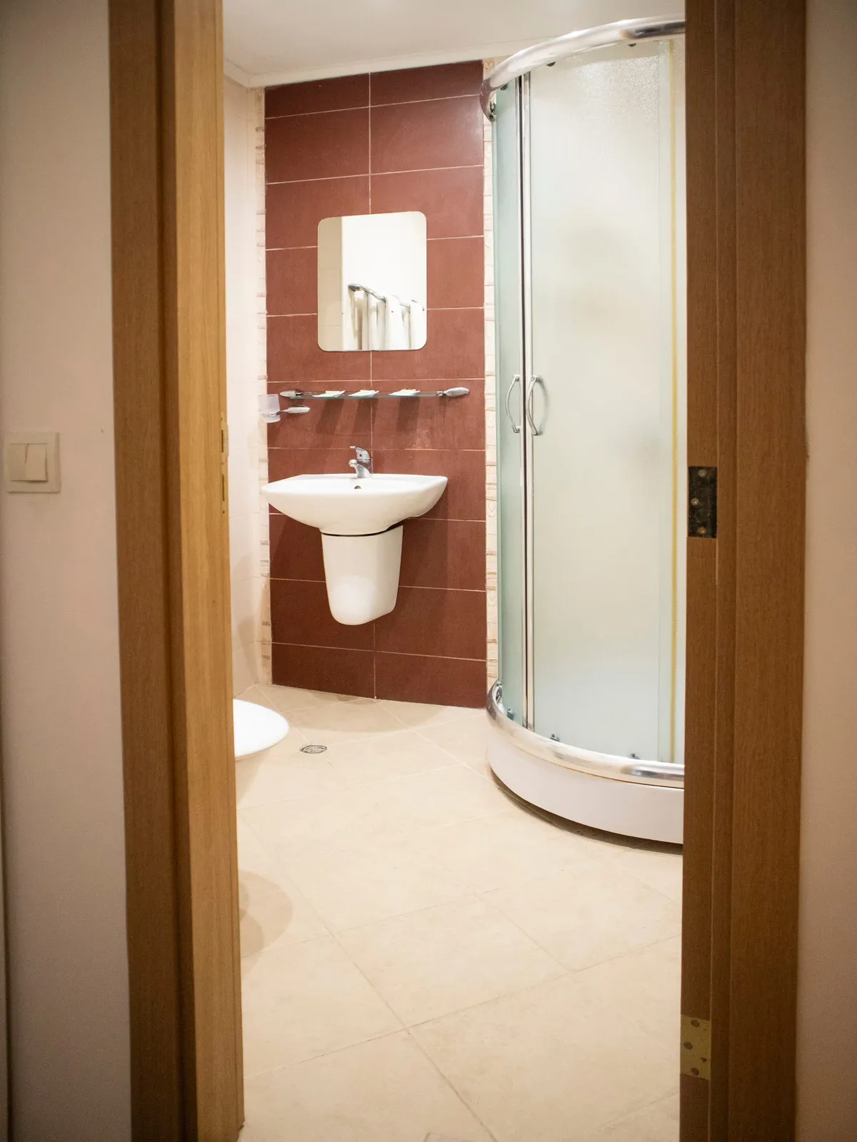 Family Room: bathroom with shower cabin and washbasin