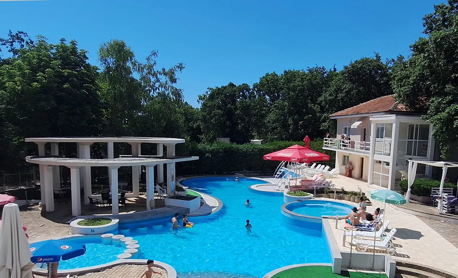 Villa: the villa and the hotel outdoor pool